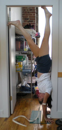 Here I am in the doorway of the Yoga Center storage closet.  I'm pretty well propped with the doorframe, a strap around my elbows, and the wedge under my wrists. It looks to me as though my neck is not relaxed, and I'd like to get my upper back in a bit.  I'm delighted that I can get this far again, though.